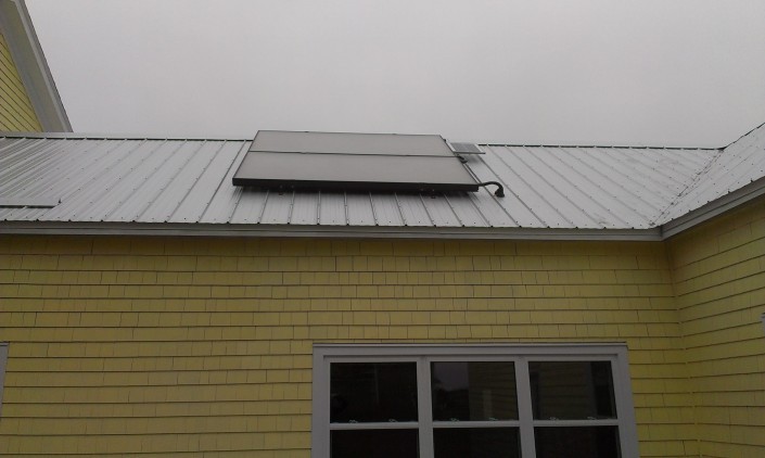Solar hot water heater and photovoltaic panel on the roof at Open Sky.